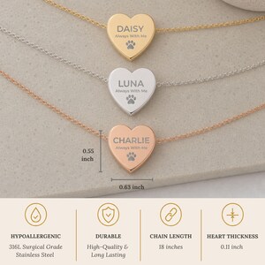 May include: Three heart-shaped pendant necklaces in gold, silver, and rose gold tones. Each pendant is engraved with a name, the text Always With Me, and a paw print. Dimensions are 0.55 inches by 0.63 inches. The chain length is 18 inches.