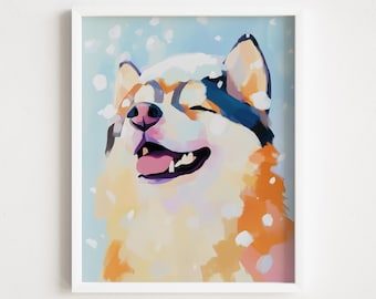 May include: A framed art print of a Shiba Inu dog enjoying the snow. The dog's face is painted with shades of orange, white, and blue, with a pink tongue and closed eyes. The background is a light blue with white snow.