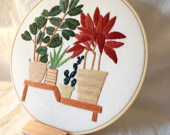 Bordados hechos a mano con plantas de interior