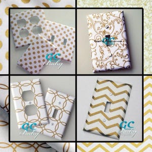 May include: Set of six decorative light switch and outlet covers featuring various gold and white patterns. The patterns include polka dots, damask, chevron, and geometric designs.