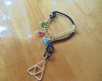 The L.O.Z.® Wise Ear Bend with Hanging Spiritual Stones and Triforce in Black