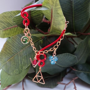 L.O.Z.® Wise Ear Bend with Hanging Spiritual Stones and Triforce in Red image 1