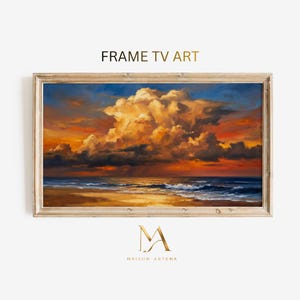 May include: A framed landscape painting depicts a sunset over a beach. The sky is filled with orange and yellow clouds, and the ocean waves are visible. The frame is made of light-colored wood. The text "FRAME TV ART" is at the top.