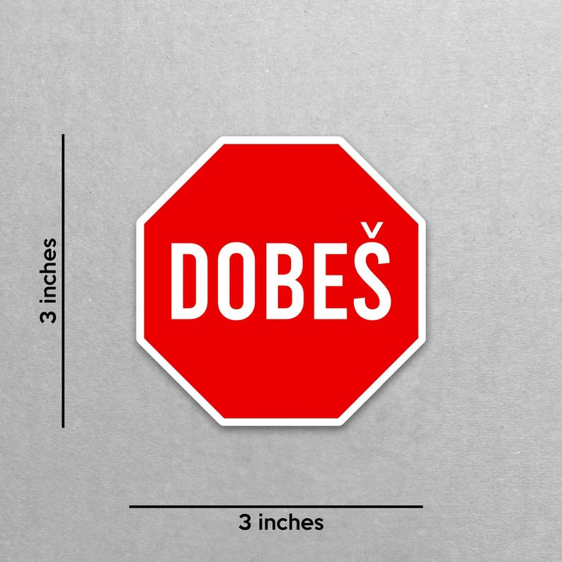May include: A red, octagonal sticker with the word "DOBE&Scaron;" in white, measuring 3 inches by 3 inches. The sticker has a white border and is on a gray background. The text is in a bold, sans-serif font.