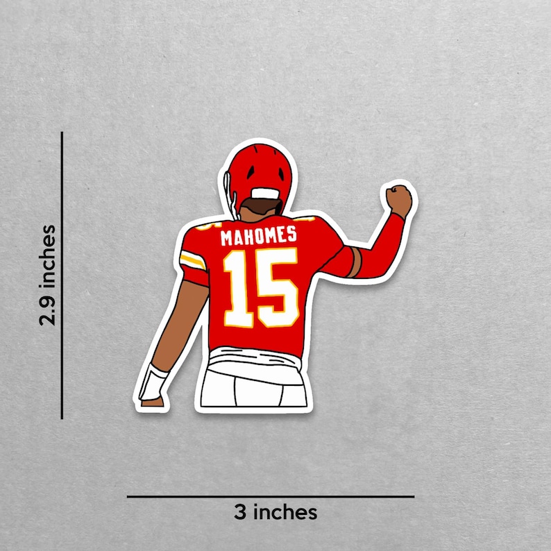 May include: A sticker featuring a cartoon illustration of a football player in a red uniform with the name "Mahomes" and the number "15". The sticker is approximately 3 inches wide and 2.9 inches tall.