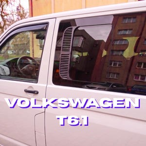 May include: A white Volkswagen T6.1 van featuring a black louvered air vent panel installed on the side window. The vehicle has a black door handle and a visible steering wheel inside the cabin. The text VOLKSWAGEN T6.1 is overlaid on the image.