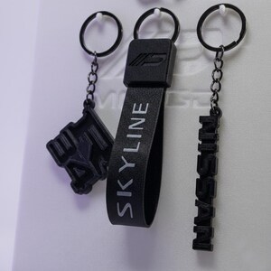 Porte-clés personnalisé Nissan Skyline R34 GTR | Kit d'accessoires JDM Skyline RB26DETT | Cadeau original pour passionnés d'automobile | Lanière avec emblème japonais