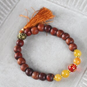Mala Bracelet - Yellow Jade and Rosewood, Rust Tassel bracelet, Etched Quartz Om Bead - Stretch bracelet, 6 1/2&quot;, stacking bracelet, yoga