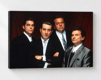 May include: A rectangular canvas print featuring a portrait of four men in formal suits against a dark red background. The men are dressed in black and grey jackets with white shirts and ties, posed together in a group shot for a cinematic display.