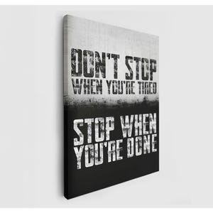 The image is a motivational poster with the text "DON'T STOP WHEN YOU'RE TIRED" and "STOP WHEN YOU'RE DONE" printed on it.