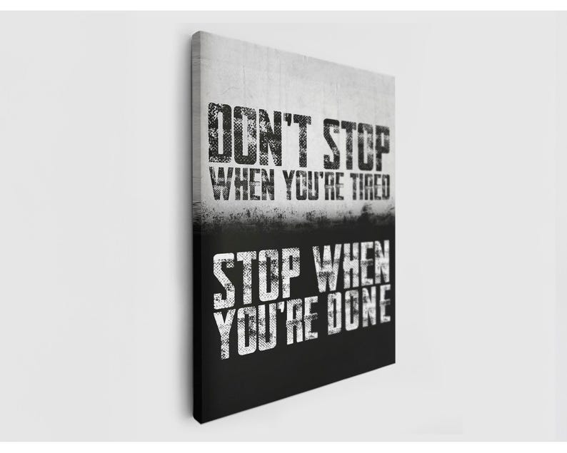 The image is a motivational poster with the text "DON'T STOP WHEN YOU'RE TIRED" and "STOP WHEN YOU'RE DONE" printed on it.