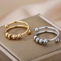 Beaded Anxiety Ring, Mindfulness Fidget Ring, Adjustable Stainless Steel Spinner Ring, Stress Relief Jewelry, Minimalist Gold & Silver Ring product logo