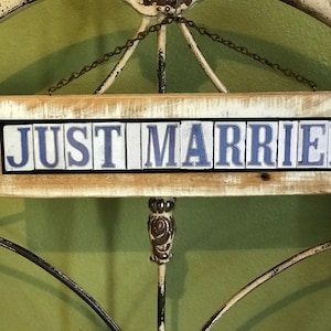 May include: A wooden sign with the words 