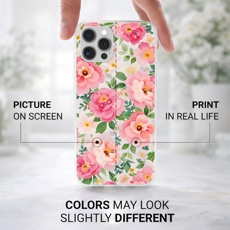May include: A clear phone case featuring a floral design with pink and peach flowers, green leaves, and white accents. The text on the case reads "PICTURE ON SCREEN" and "PRINT IN REAL LIFE". The bottom of the case reads "COLORS MAY LOOK SLIGHTLY DIFFERENT".