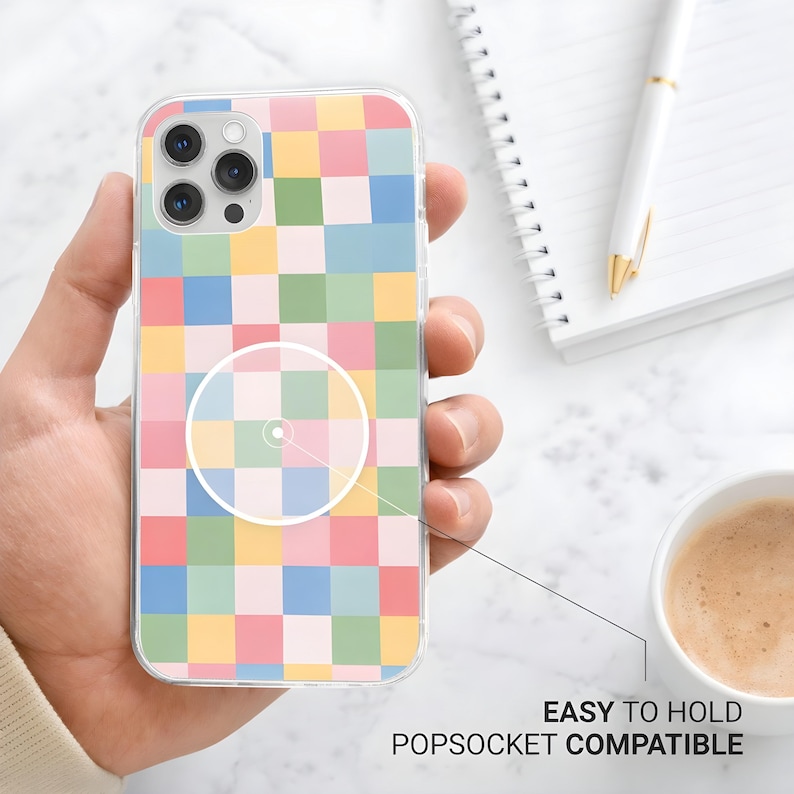 May include: A clear phone case with a colorful checkerboard pattern in pastel shades of pink, yellow, green, and blue. The case is labeled "EASY TO HOLD POPSOCKET COMPATIBLE".