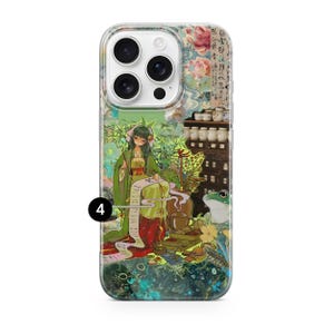 May include: A phone case featuring an anime-style illustration of a woman in a green kimono, writing on a scroll. The design includes a frog, tea sets, and floral elements, with a colorful, detailed aesthetic.