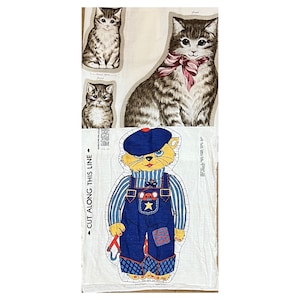 May include: Vintage fabric panel featuring cat illustrations. The panel includes three cat portraits and a cartoon cat wearing overalls and a blue cap. The words "CUT ALONG THIS LINE" are printed on the side.