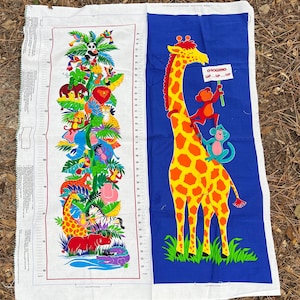 May include: Two colorful fabric panels with jungle animal designs. One panel features a height chart with a giraffe, zebra, and other animals. The other panel has a giraffe with monkeys and the text "Growing Up...Up...Up".
