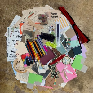 May include: A collection of colorful paper scraps, including patterned paper, cardstock, and decorative paper. There are also several markers, pencils, and a few beads. The text "Buy a little, add a little" and "Down My Walkin'" is visible on the paper scraps.