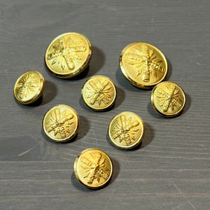 Vintage Gold Shank Metal Buttons . 8 buttons
