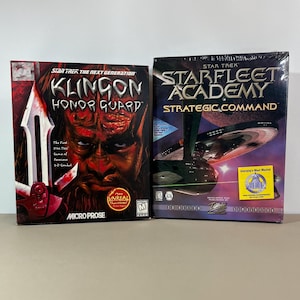 May include: Two vintage Star Trek PC game boxes. One is "Star Trek: The Next Generation - Klingon Honor Guard" with a Klingon warrior graphic. The other is "Star Trek: Starfleet Academy - Strategic Command" with a spaceship graphic.