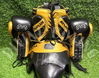 Zestaw bokserski Rival Professional – czarno-złote rękawice, kask i ochraniacz na krocze