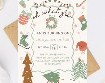 May include: A festive invitation with the text "oh what fun" and "LIAM IS TURNING ONE." The design includes Christmas-themed illustrations like a Christmas tree, ornaments, and a car carrying a tree. The invitation is on a cream background.