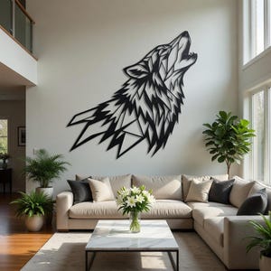 May include: A large, black metal wall art piece depicting a howling wolf. The artwork is mounted on a white wall above a beige sectional sofa. The wolf design is geometric and modern, with sharp angles and lines.