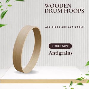 Könnte beinhalten: Ein helles Holztrommel-Reifen, auf einer weißen Oberfläche dargestellt. Der Text "WOODEN DRUM HOOPS" steht oben, darunter "ALL SIZES ARE AVAILABLE". Eine Schaltfläche lautet "ORDER NOW" mit dem Namen "Antigrains" darunter.