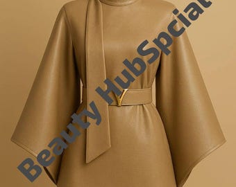 May include: A tan leather jacket with a high collar and wide sleeves. The jacket is cinched at the waist with a belt featuring a gold-colored buckle. A matching tie detail hangs from the collar. The words "Beauty HubSpecial" are printed on the jacket.