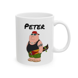May include: White ceramic mug featuring a cartoon illustration of a character named Peter. Peter is depicted wearing a red cap, sunglasses, and holding a skateboard. The name "PETER" is printed in black above the character.