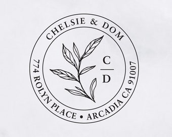 May include: A black and white return address stamp with the text "CHELSIE & DOM" and "774 ROLYN PLACE ARCADIA CA 91007" around a simple floral design with the initials "C/D".