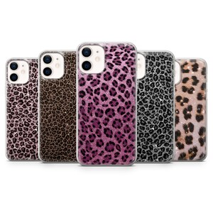 May include: Five smartphone cases with leopard print patterns in various colours, including pink, brown, and black, with glitter detailing. The cases are designed to fit a smartphone.