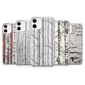 May include: A collection of phone cases featuring various tree designs. The cases display birch tree bark patterns in shades of white, gray, and brown. Some cases have bare branches, while others have green leaves.