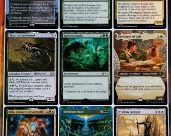 May include: A collection of nine Magic: The Gathering trading cards arranged in a three-by-three grid. The cards feature various fantasy illustrations, text descriptions, and game mechanics, including Mirari's Wake, Druid's Deliverance, Wayfaring Temple, Rhys the Redeemed, Growing Ranks, The Queen of Dale, Elda, Conjurer of Spectacle, Seedborn Muse, and Nykthos Paragon.