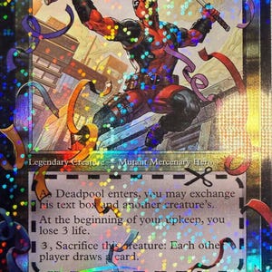 May include: A holographic trading card featuring Deadpool, a Mutant Mercenary Hero, wielding two katanas. The card has a colorful, shimmering background with text that includes the card's abilities and the text "Deadpool Trading Card".