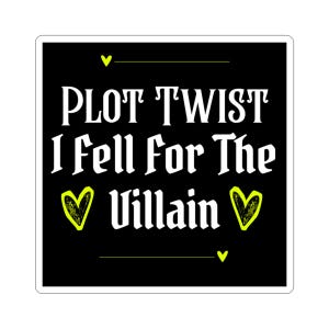 May include: A square sticker with the text "PLOT TWIST I Fell For The Villain" in white, gothic-style font. The sticker has a black background with neon yellow hearts and lines.