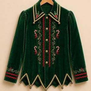 May include: A dark green velvet long-sleeve shirt featuring a pointed collar and hem with gold trim and small bells. The front is decorated with embroidered candy canes, holly leaves, and red berries, finished with gold buttons and red rickrack.