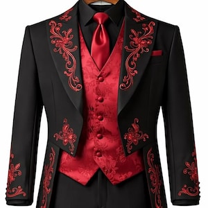 May include: A black tailcoat suit featuring red floral embroidery on the lapels and cuffs, paired with a red patterned vest, a black dress shirt, a red necktie, and black trousers. The tailcoat has a red lining and a structured silhouette.