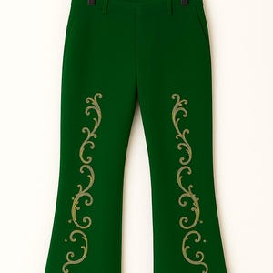 May include: Dark green trousers featuring gold-colored embroidered scrollwork patterns running vertically down the front of each leg. The hem of each pant leg is finished with a thick, textured tan-colored faux fur trim.