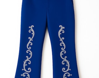 May include: Bright blue trousers hanging on a black plastic hanger. The pants feature a straight-leg cut with a waistband, belt loops, and side pockets. Each leg is decorated with a vertical, symmetrical silver-toned filigree pattern.
