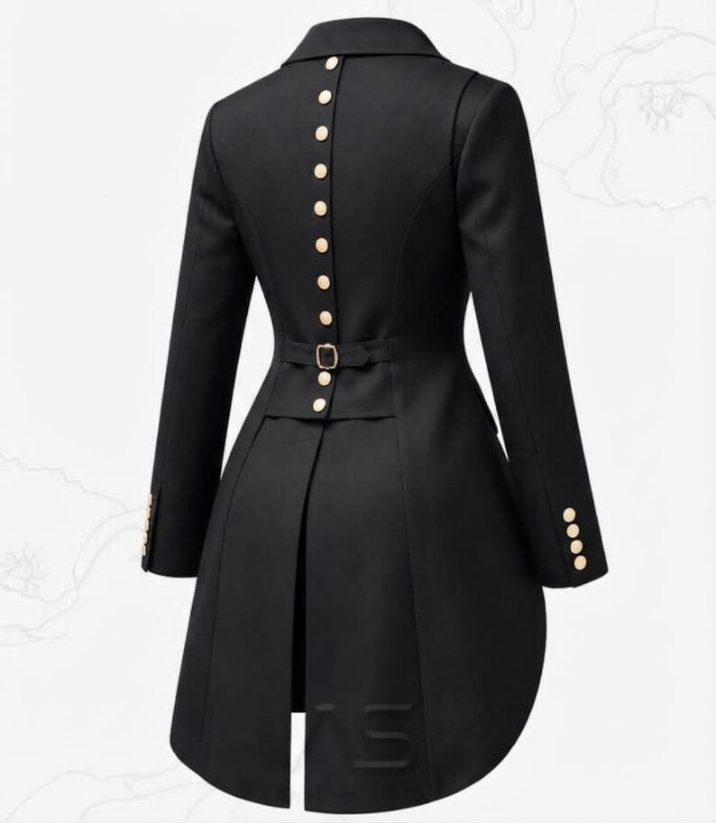 May include: A black long-sleeved jacket featuring a high collar and a row of gold-toned buttons running vertically down the centre back. The garment includes a waist-cinching strap with a gold buckle and four gold buttons on each sleeve cuff.