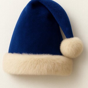 May include: A deep blue velvet Santa-style hat featuring a thick, cream-colored faux fur trim around the base and a matching cream-colored faux fur pom-pom attached to the tip of the folded crown, creating a soft and textured holiday accessory.