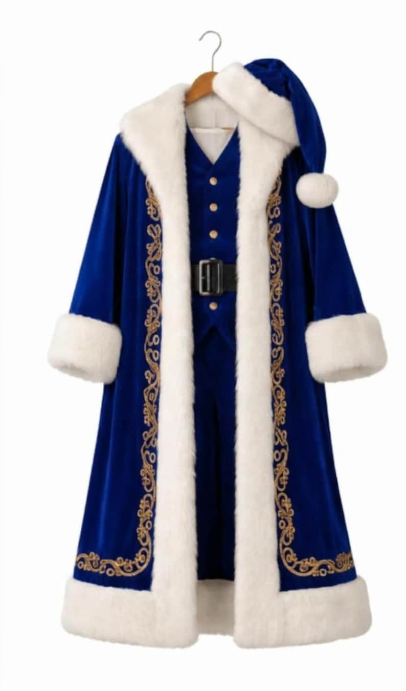 May include: A royal blue velvet coat featuring thick white faux fur trim on the collar, cuffs, and hem, accented with intricate gold embroidery. The set includes a matching blue vest with gold buttons, a black belt, and a blue hat with white fur.