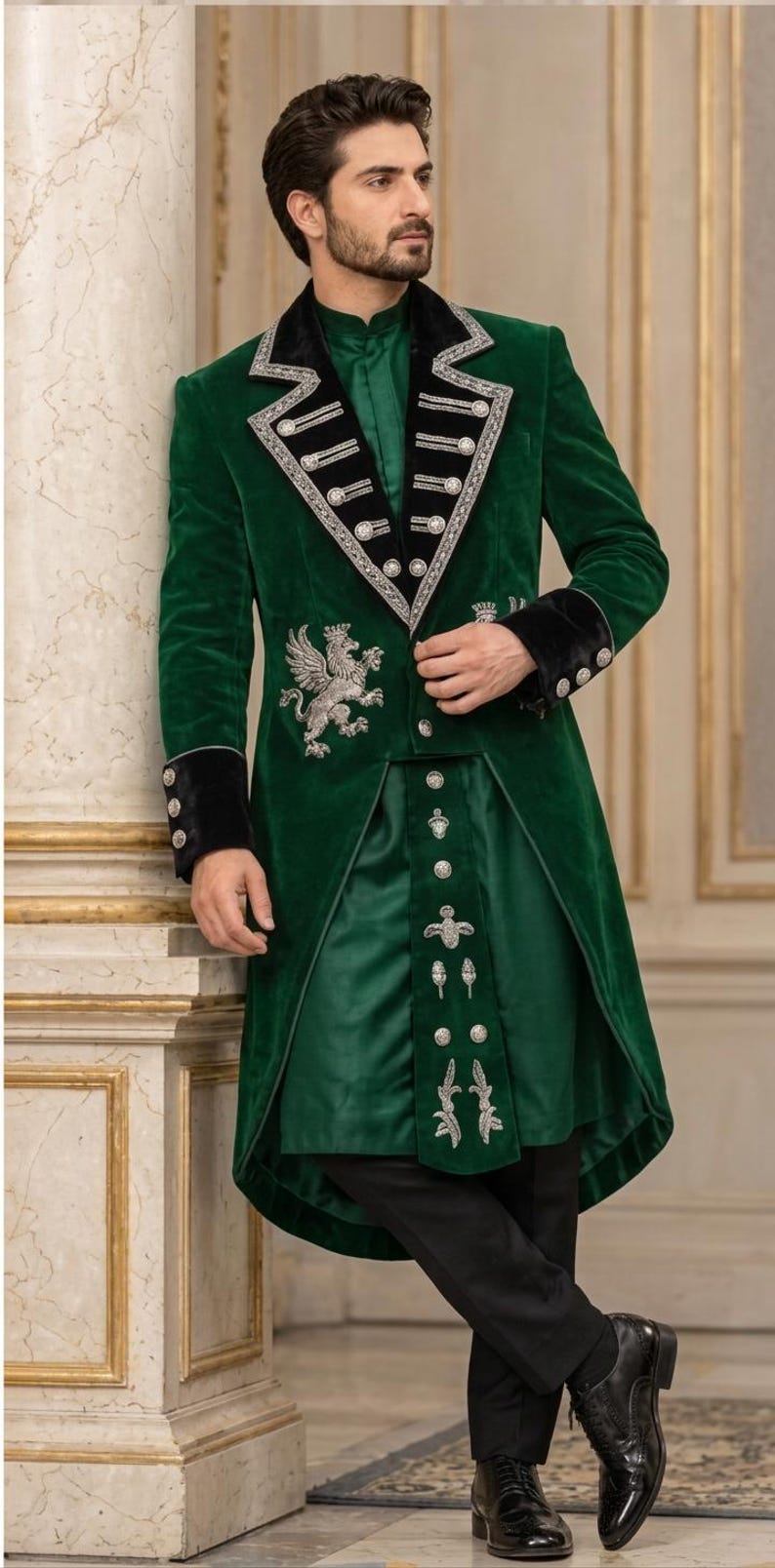 May include: A dark green velvet long coat featuring black velvet lapels and cuffs, silver embroidery, and metallic buttons. The coat displays a prominent silver griffin emblem on the chest, paired with a matching green tunic and black trousers.