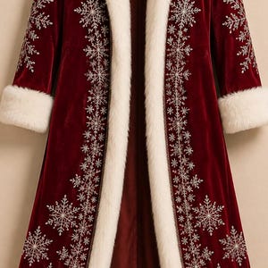 May include: A long, deep red velvet coat featuring a thick, white faux fur trim along the front opening, collar, and sleeve cuffs. The coat is decorated with intricate, silver-colored embroidered snowflake patterns along the front and sleeves.