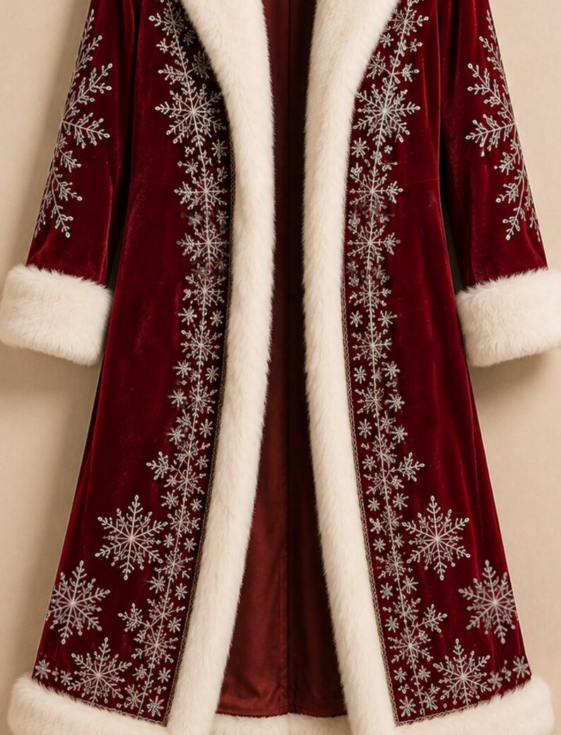 May include: A long, deep red velvet coat featuring a thick, white faux fur trim along the front opening, collar, and sleeve cuffs. The coat is decorated with intricate, silver-colored embroidered snowflake patterns along the front and sleeves.