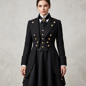 May include: A black coat and waistcoat ensemble featuring gold buttons, detailed embroidery on the lapels and cuffs, and a high collar with a black cravat secured by a central dark stone brooch. The garment includes a flared skirt section and long sleeves.