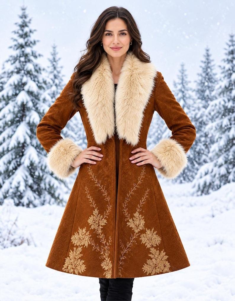 May include: A knee-length brown coat featuring a wide cream-colored faux fur collar and matching faux fur cuffs. The coat is decorated with intricate gold-toned floral embroidery extending from the hemline up the front panels.