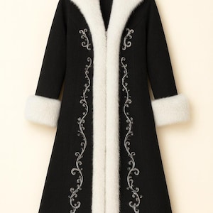 May include: A long black coat featuring a thick white faux fur collar, white faux fur cuffs, and white faux fur trim along the front opening. The coat is decorated with intricate silver embroidery in a scrolling vine pattern on both sides.